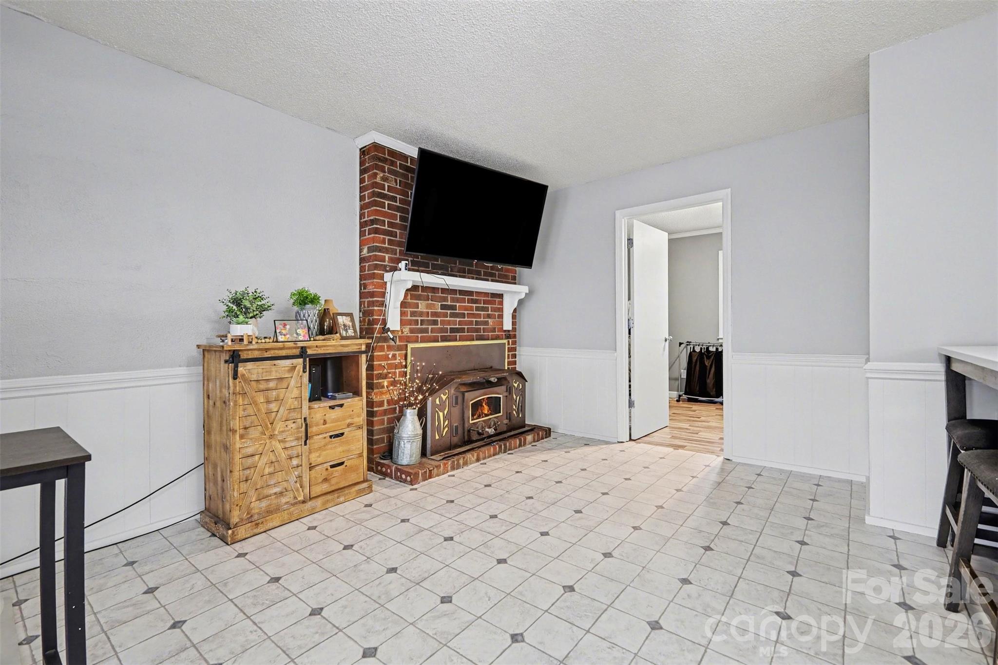 1008 Edgewood Road Bessemer City, NC 28016 - Photo 17 of 26 a room with furniture and a flat screen tv