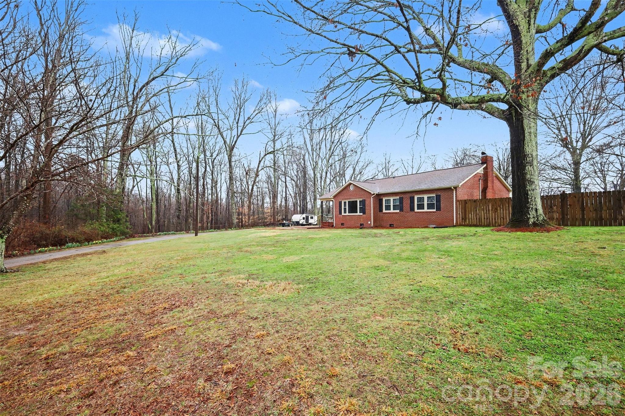 1008 Edgewood Road Bessemer City, NC 28016 - Photo 2 of 26 a front view of house with yard and trees in the background