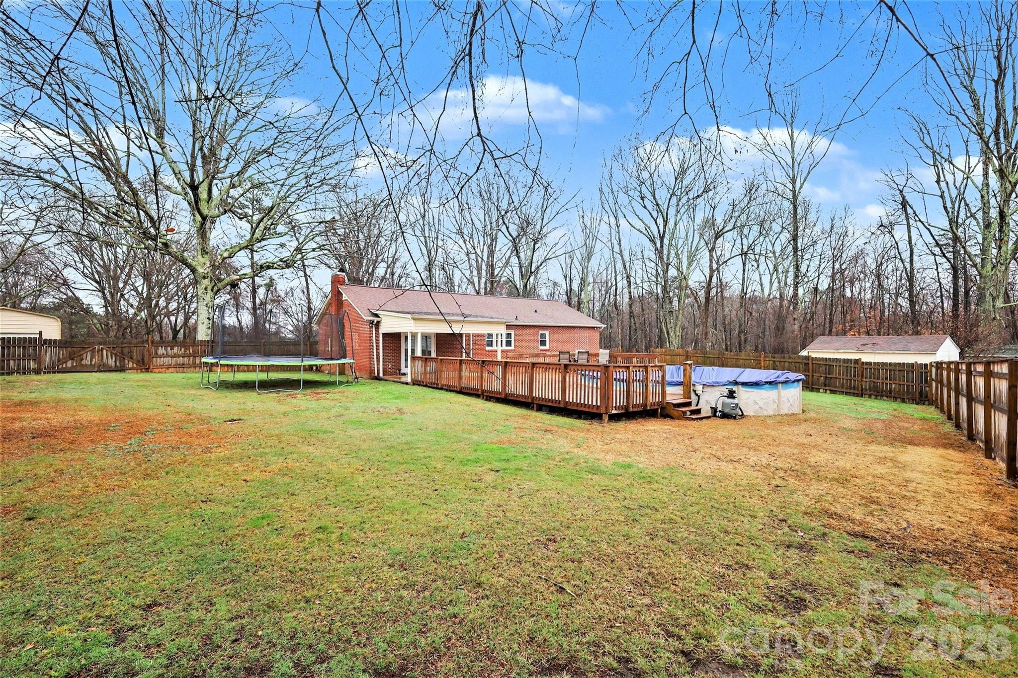 1008 Edgewood Road Bessemer City, NC 28016 - Photo 23 of 26 a view of a house with a yard and sitting area