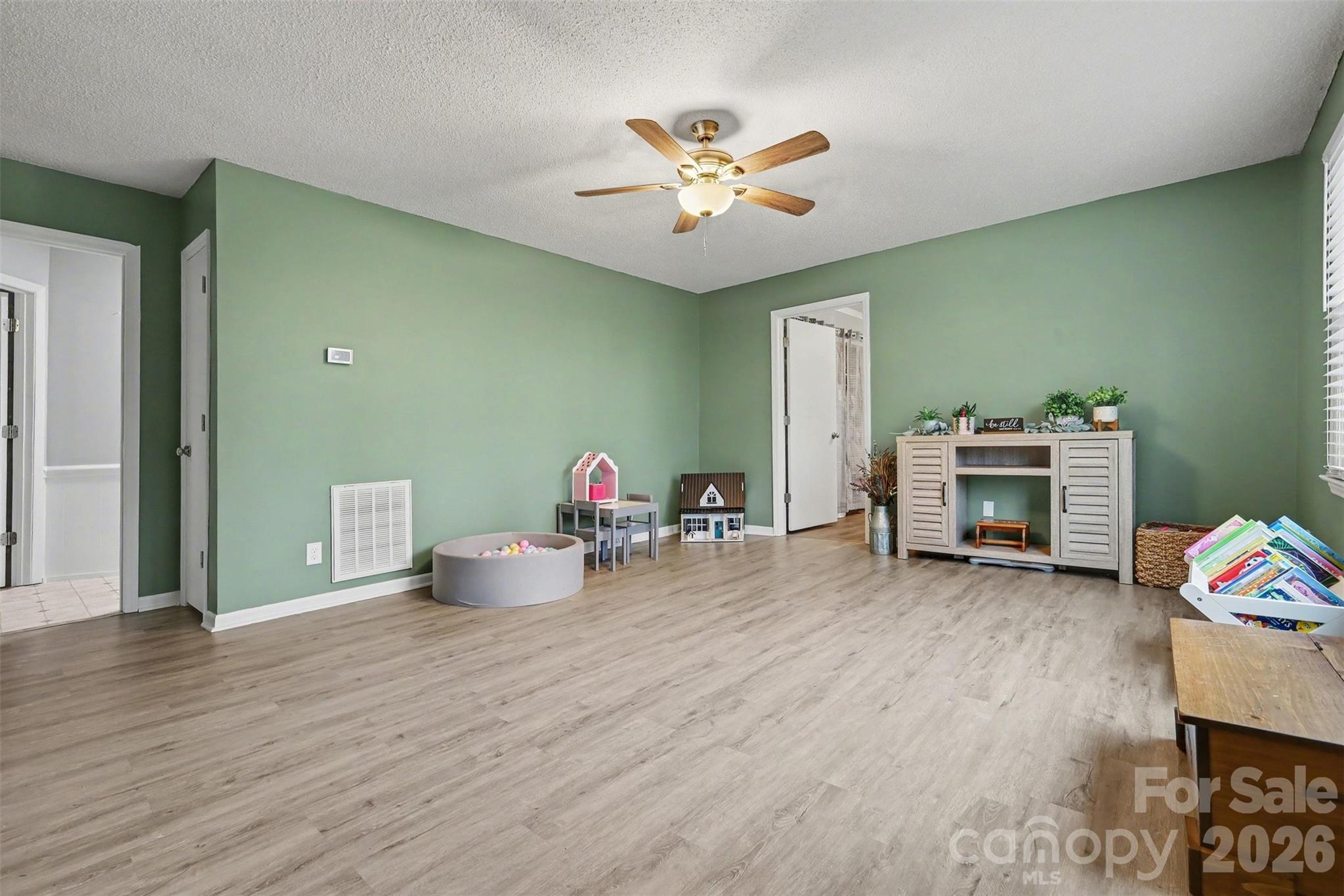 1008 Edgewood Road Bessemer City, NC 28016 - Photo 6 of 26 a living room with furniture and a wooden floor