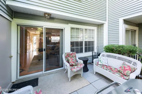 a view of a house with swimming pool and sitting area