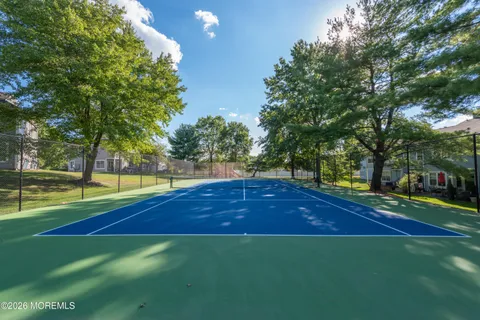 a view of yard with swimming pool and trees
