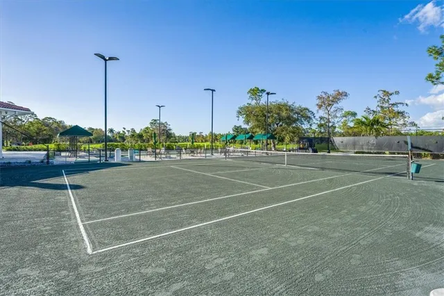 a view of a swimming pool with a patio
