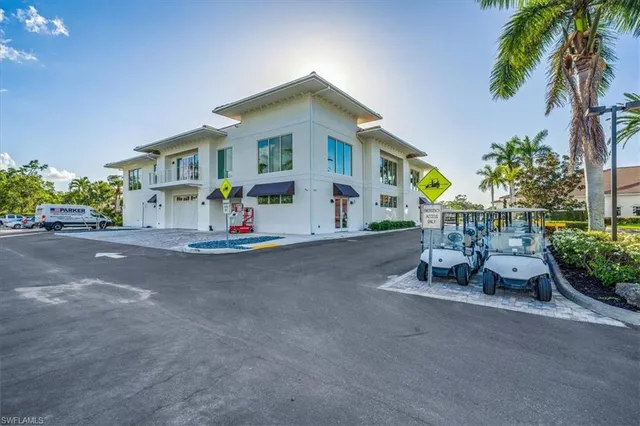 a view of a swimming pool with an outdoor seating and hardwood