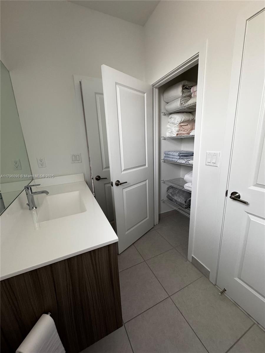 4409 Southwest 173rd Avenue Miramar, FL 33029 - Photo 26 of 38 a bathroom with a sink and a mirror