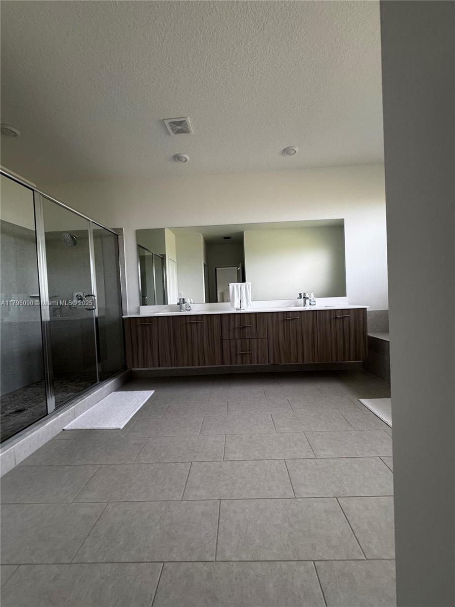 4409 Southwest 173rd Avenue Miramar, FL 33029 - Photo 35 of 38 a view of an empty room with cabinet and mirror