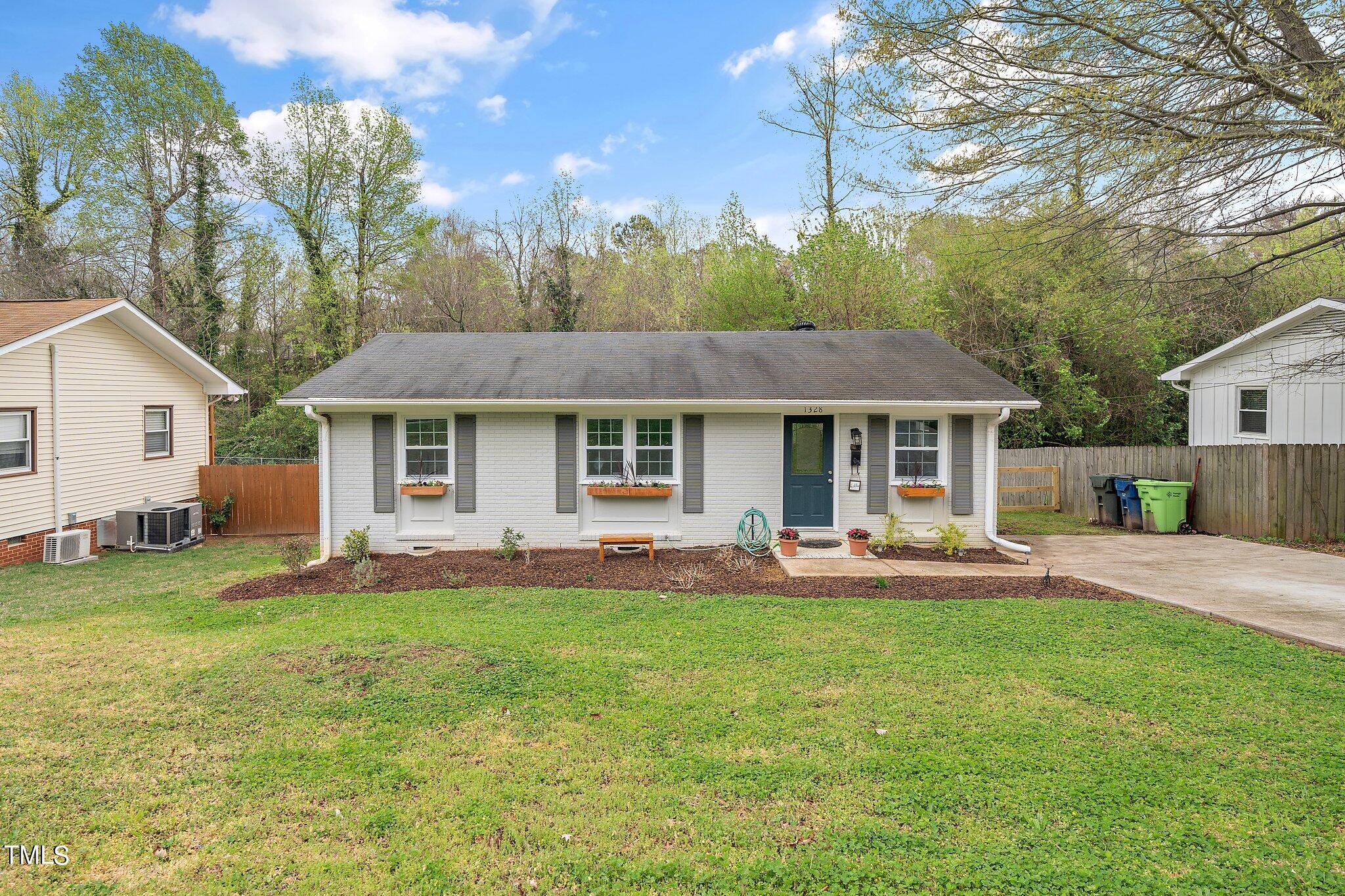 1328 Marlborough Road Raleigh, NC 27610 - Photo 1 of 20 a front view of house with yard and outdoor seating
