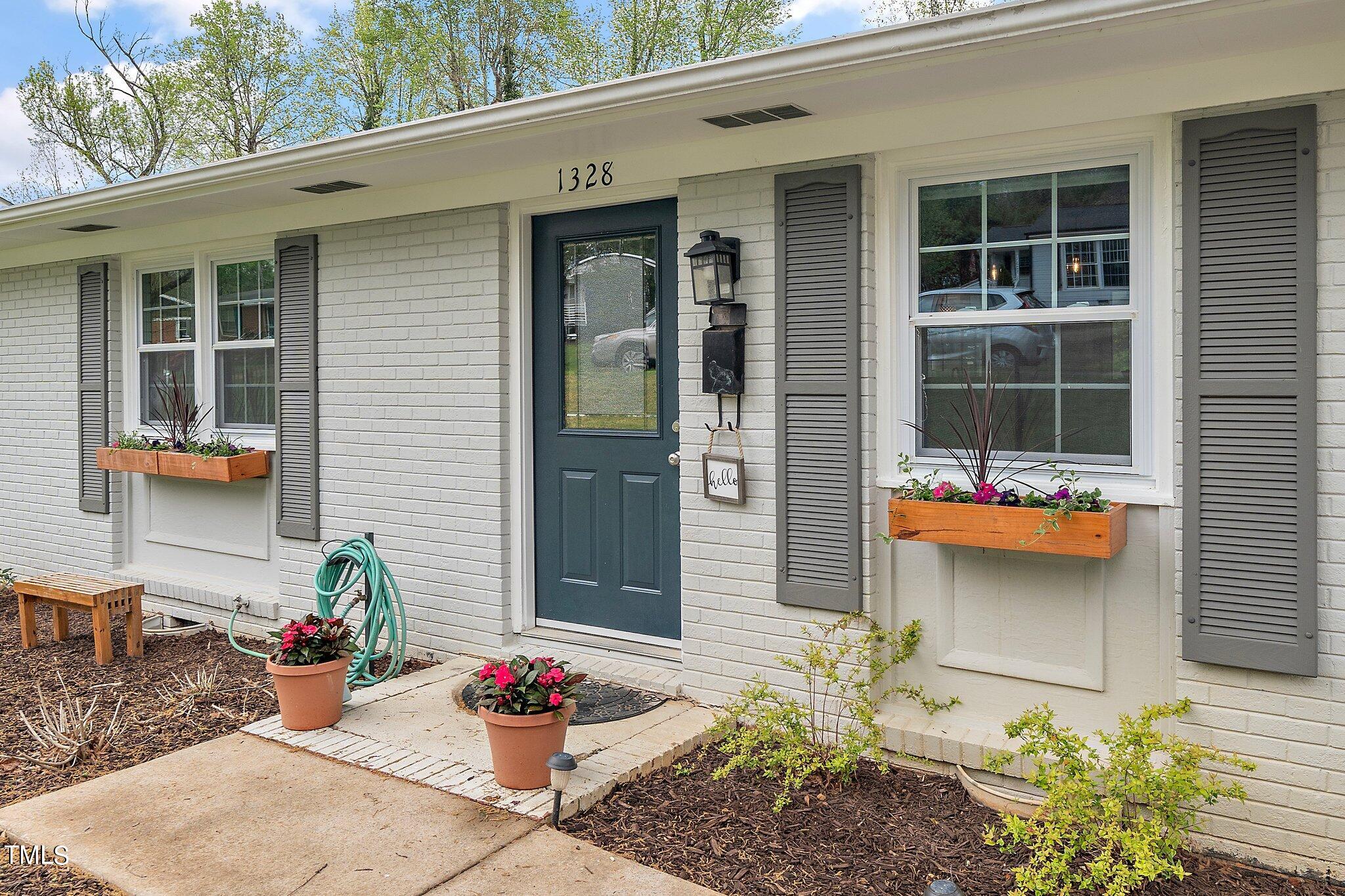 1328 Marlborough Road Raleigh, NC 27610 - Photo 3 of 20 a front view of a house with a yard