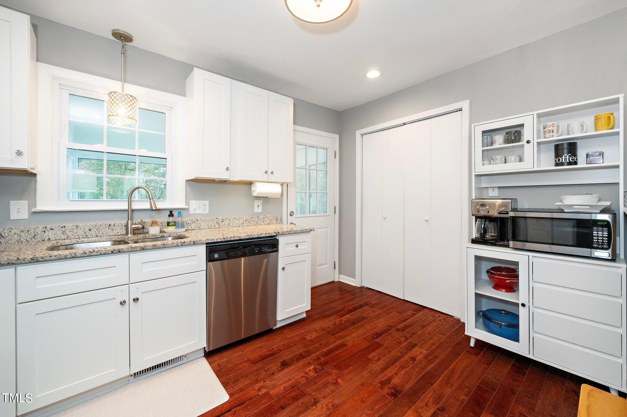 1328 Marlborough Road Raleigh, NC 27610 - Photo 8 of 20 a kitchen with granite countertop white cabinets and white appliances