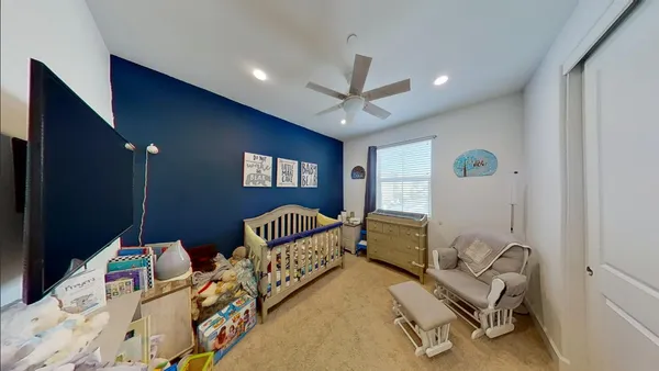 a bedroom with furniture and a window