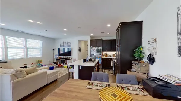 a living room with furniture fireplace and window