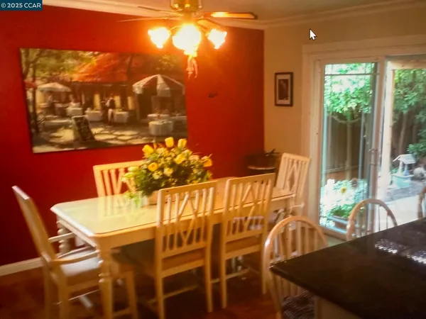 a view of a dining room with furniture and window