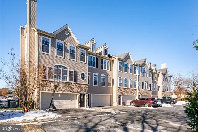 a city street lined with buildings and trees