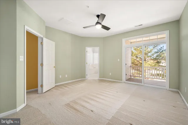 a view of room with ceiling fan