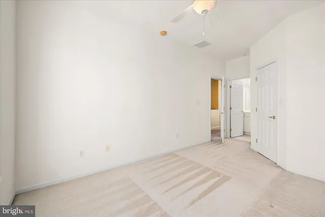 a room with gym equipment and windows