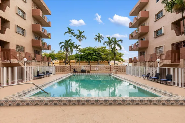 a view of a swimming pool with a patio