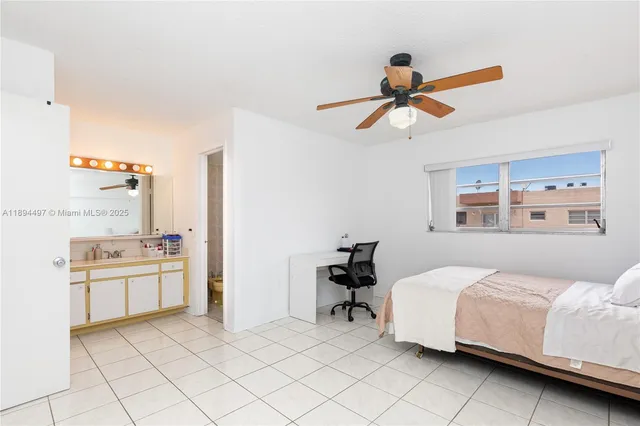 a bed room with a bed and a chandelier