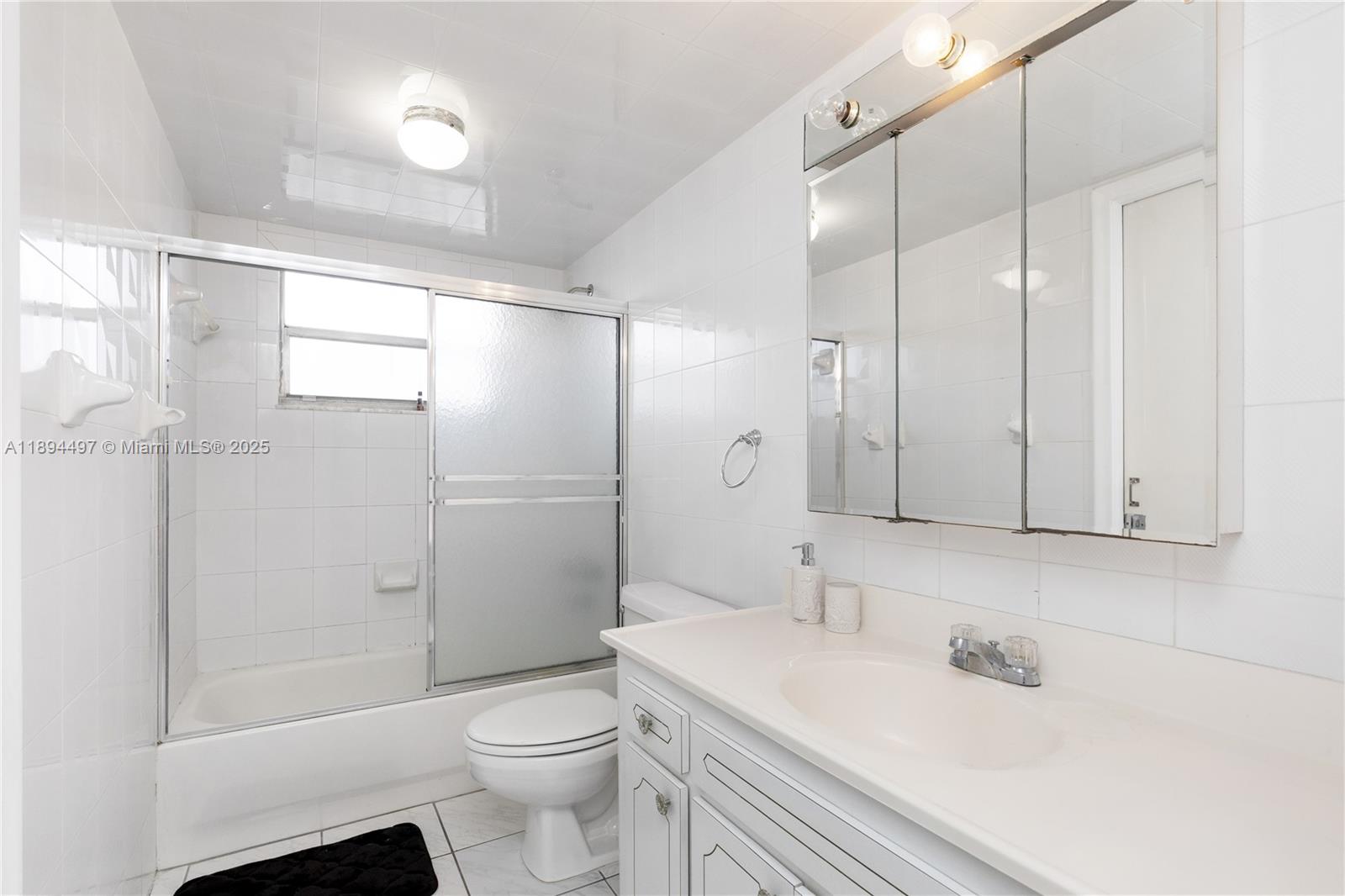 1630 West 46th Street, Unit 514B Hialeah, FL 33012 - Photo 14 of 26 a bathroom with a sink a toilet and shower