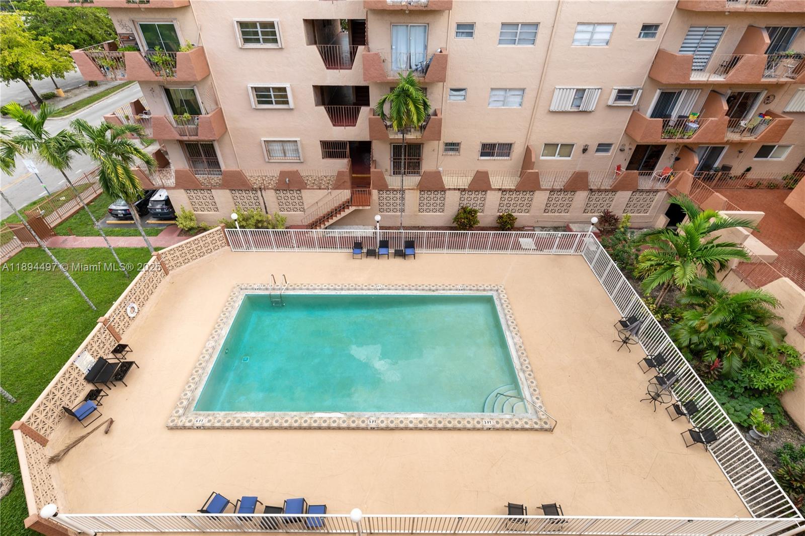 1630 West 46th Street, Unit 514B Hialeah, FL 33012 - Photo 19 of 26 a view of swimming pool with outdoor seating