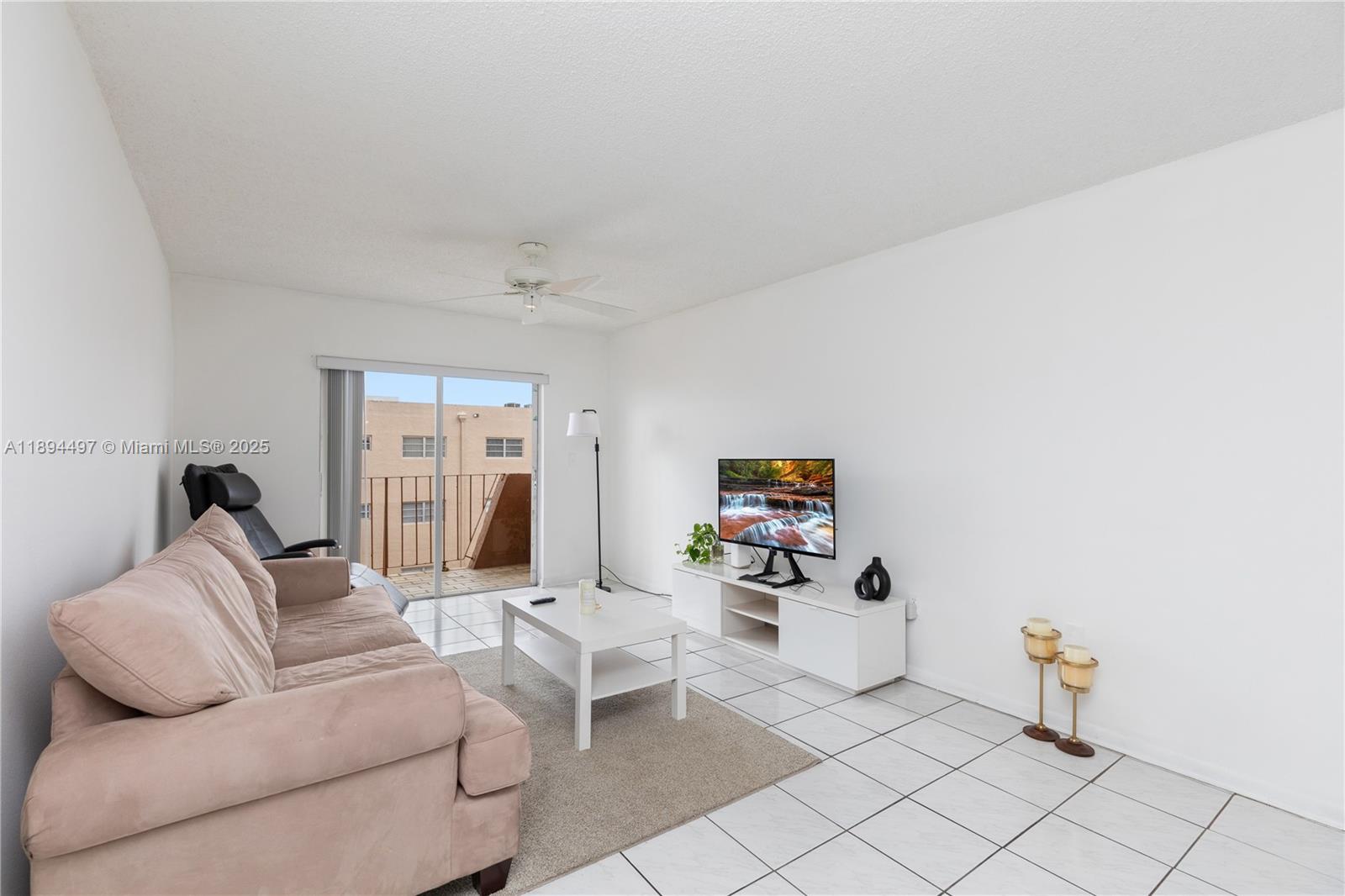 1630 West 46th Street, Unit 514B Hialeah, FL 33012 - Photo 3 of 26 a living room with furniture