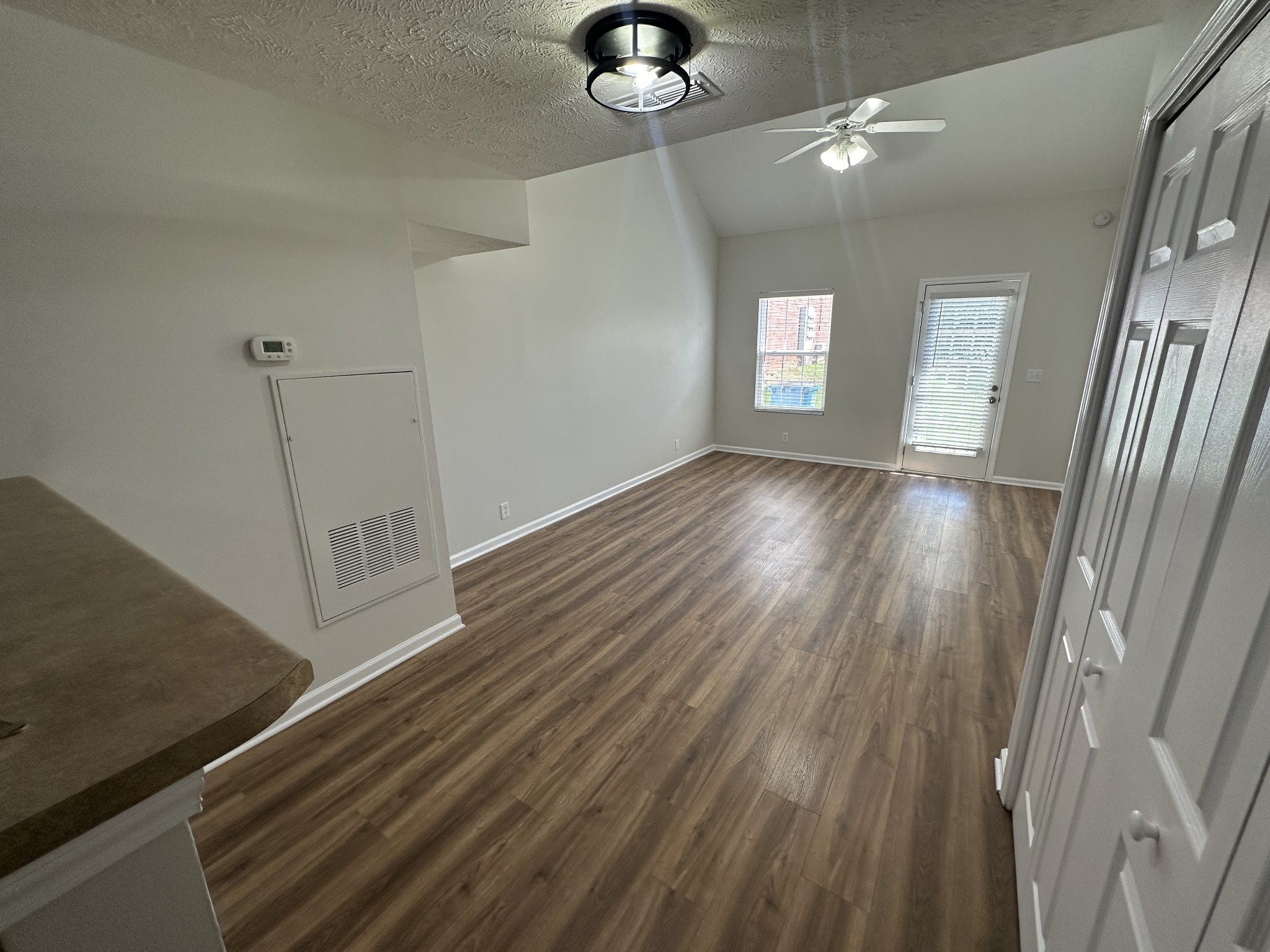 4859 Chelanie Circle Murfreesboro, TN 37129 - Photo 11 of 27 a view of a room with wooden floor and staircase