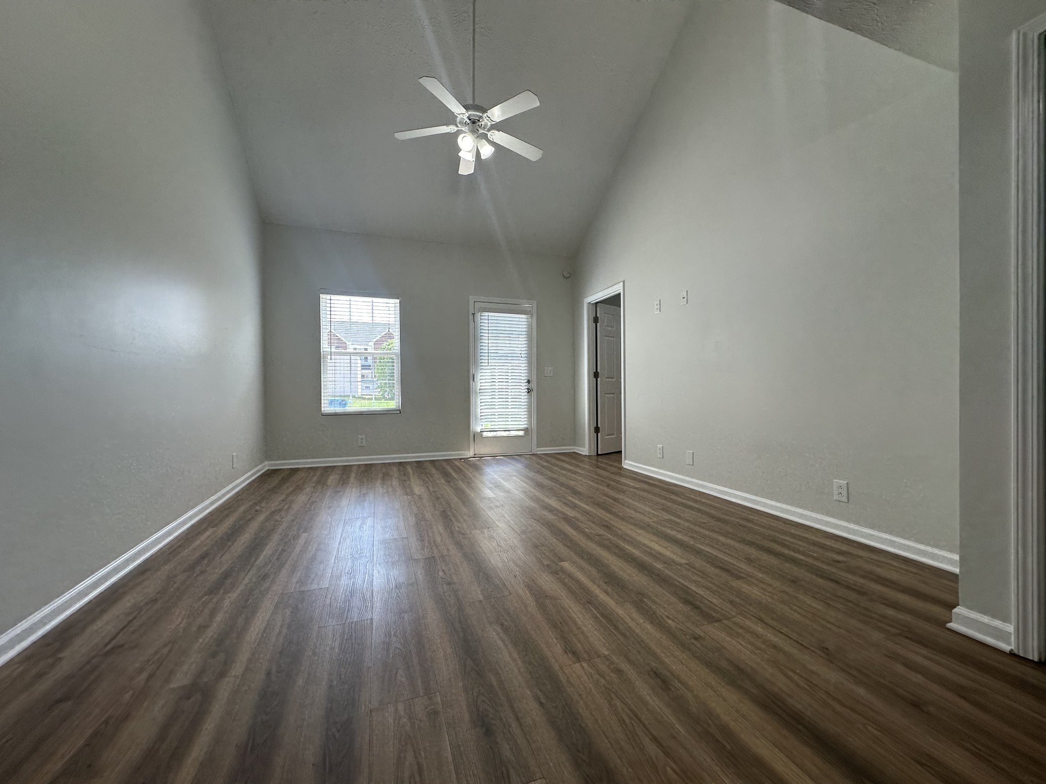 4859 Chelanie Circle Murfreesboro, TN 37129 - Photo 12 of 27 an empty room with wooden floor and windows
