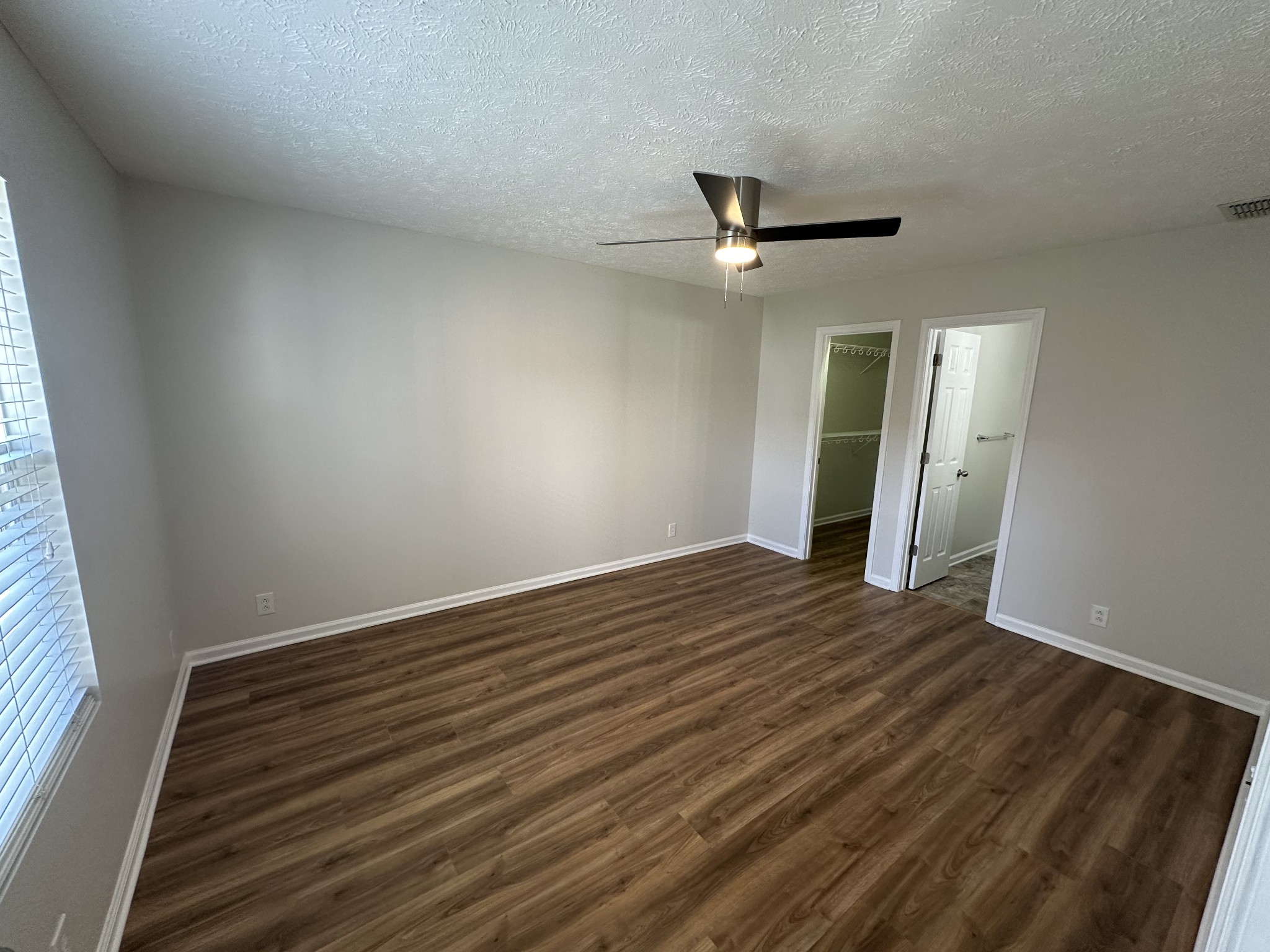 4859 Chelanie Circle Murfreesboro, TN 37129 - Photo 14 of 27 an empty room with wooden floor and windows
