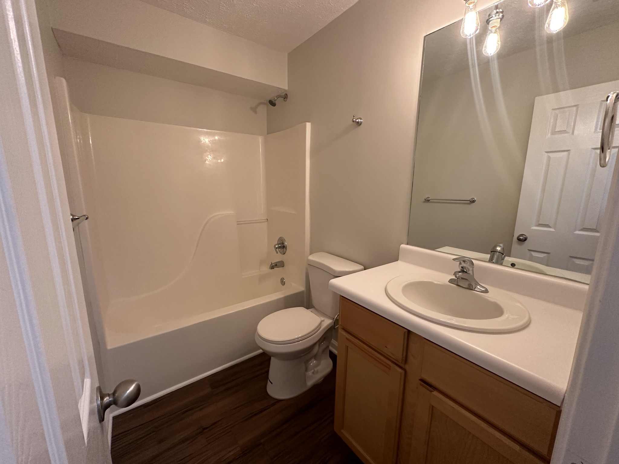 4859 Chelanie Circle Murfreesboro, TN 37129 - Photo 5 of 27 a bathroom with a sink a toilet a mirror and shower