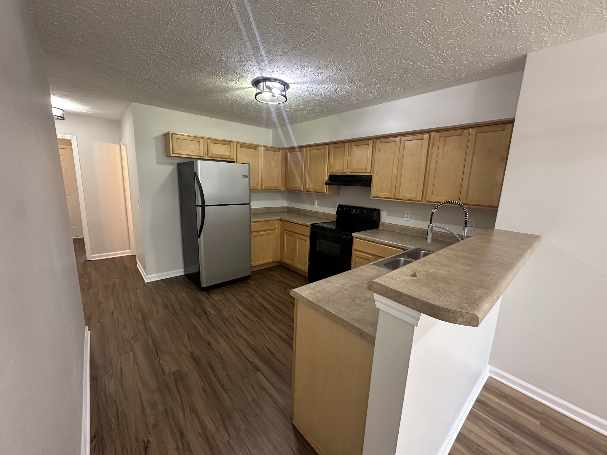 4859 Chelanie Circle Murfreesboro, TN 37129 - Photo 7 of 27 a kitchen with refrigerator and microwave