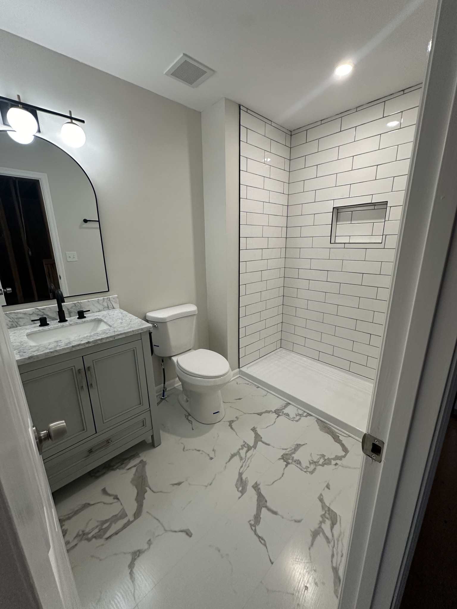 4859 Chelanie Circle Murfreesboro, TN 37129 - Photo 10 of 27 a bathroom with a sink a toilet and shower