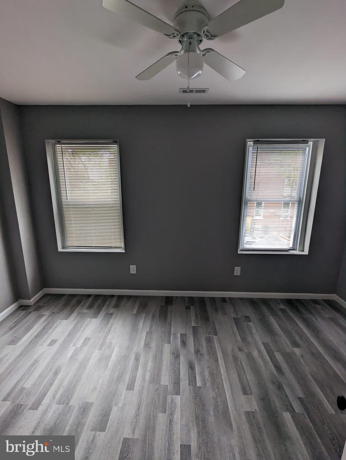 883 North Preston Street Philadelphia, PA 19104 - Photo 7 of 12 an empty room with wooden floor chandelier and windows
