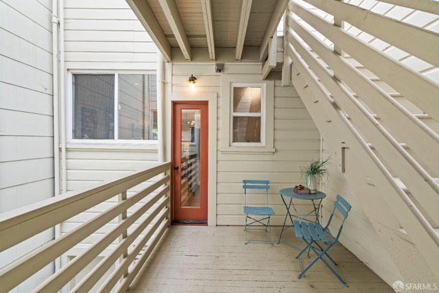a view of front door of house with stairs