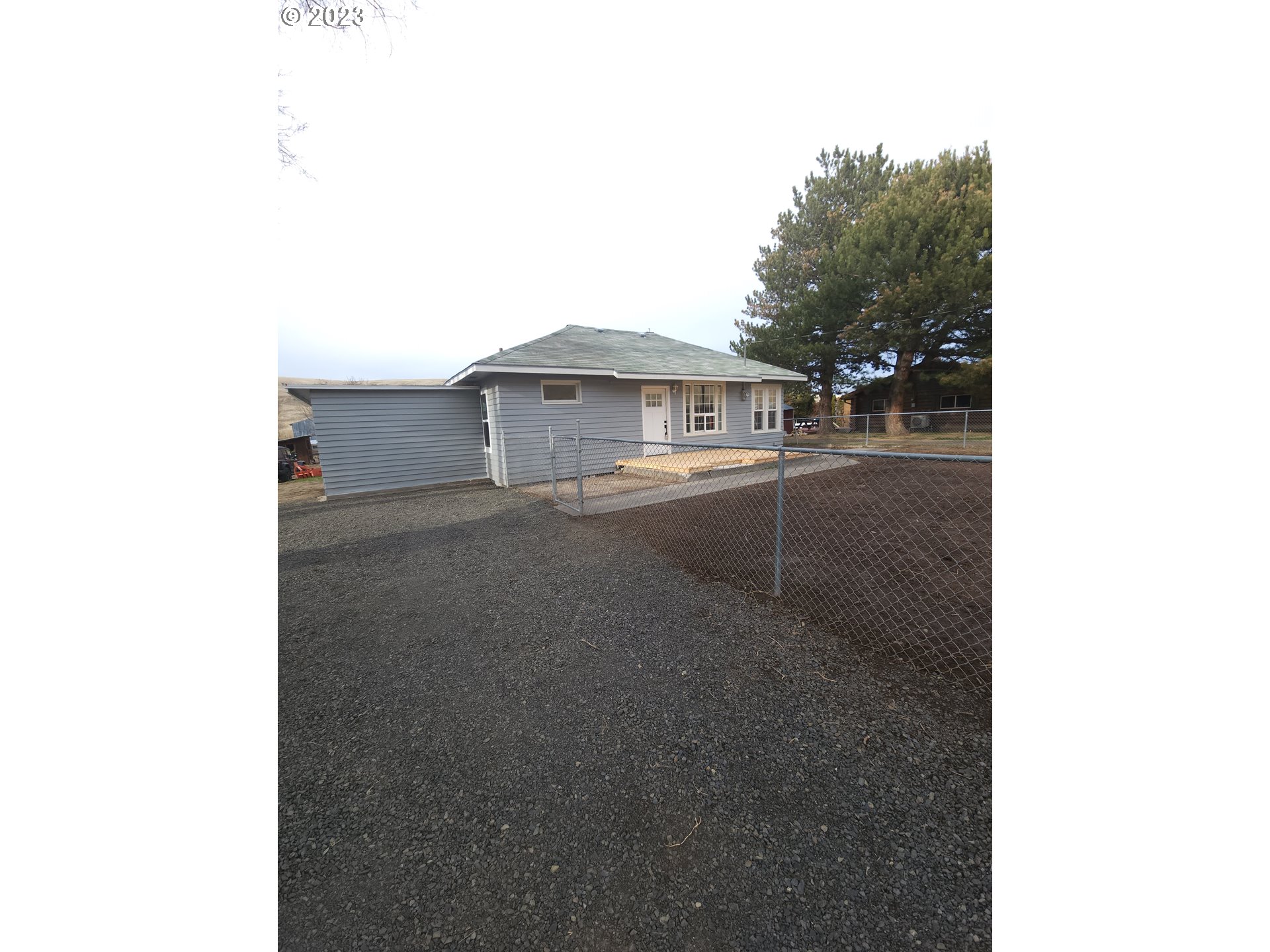 46153 Adams Road Pendleton, OR 97801 - Photo 7 of 8 a view of a house with a outdoor space