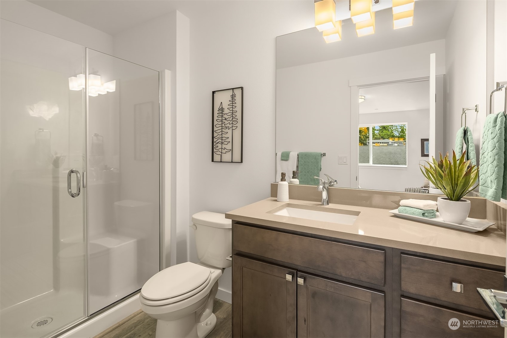 115 Southwest 181st Place, Unit C11 Normandy Park, WA 98166 - Photo 13 of 26 a bathroom with a sink a toilet and shower