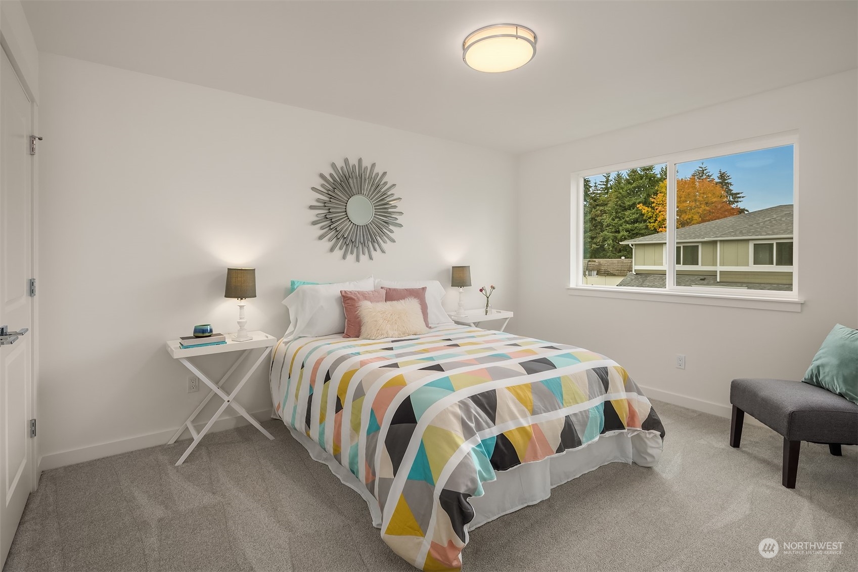 115 Southwest 181st Place, Unit C11 Normandy Park, WA 98166 - Photo 14 of 26 a bedroom with a bed and a window