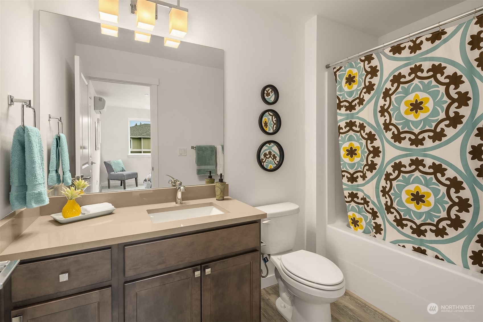 115 Southwest 181st Place, Unit C11 Normandy Park, WA 98166 - Photo 15 of 26 a bathroom with a sink and a mirror