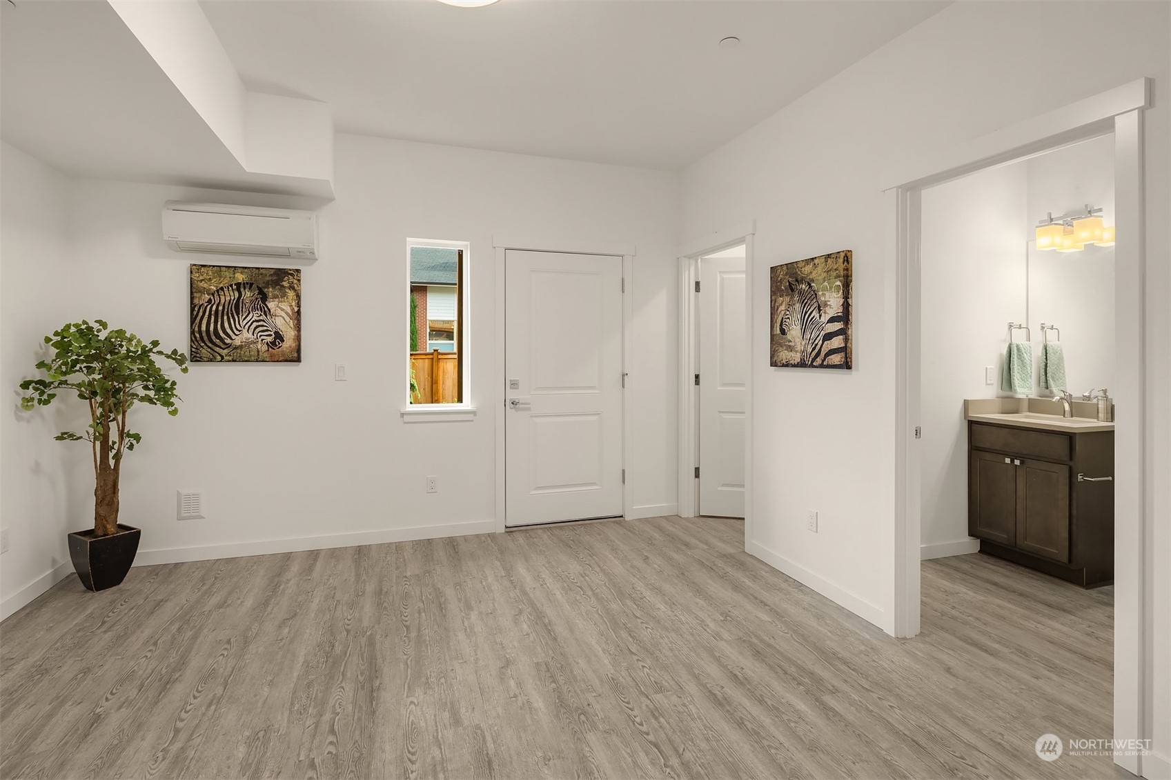 115 Southwest 181st Place, Unit C11 Normandy Park, WA 98166 - Photo 18 of 26 a view of a room with wooden floor and potted plant