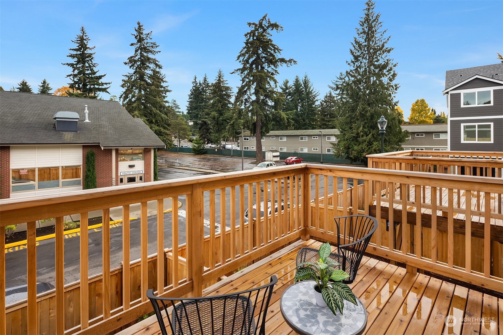 115 Southwest 181st Place, Unit C11 Normandy Park, WA 98166 - Photo 20 of 26 a view of a two chairs and table in the balcony