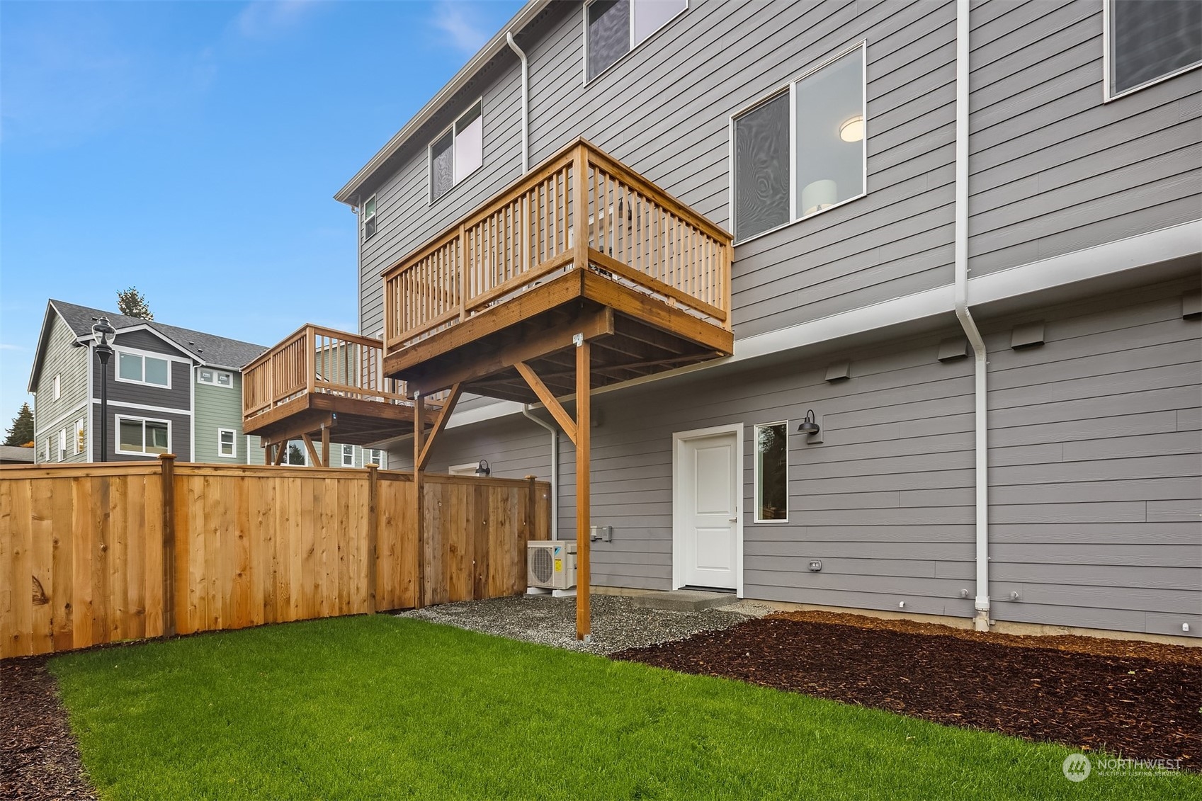 115 Southwest 181st Place, Unit C11 Normandy Park, WA 98166 - Photo 21 of 26 a view of a house with a yard
