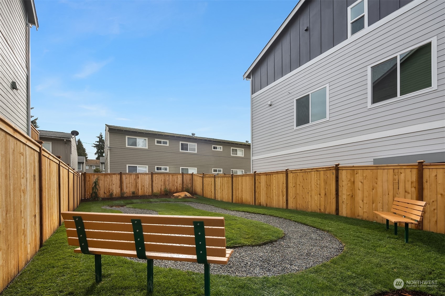 115 Southwest 181st Place, Unit C11 Normandy Park, WA 98166 - Photo 22 of 26 a front view of a house with a yard