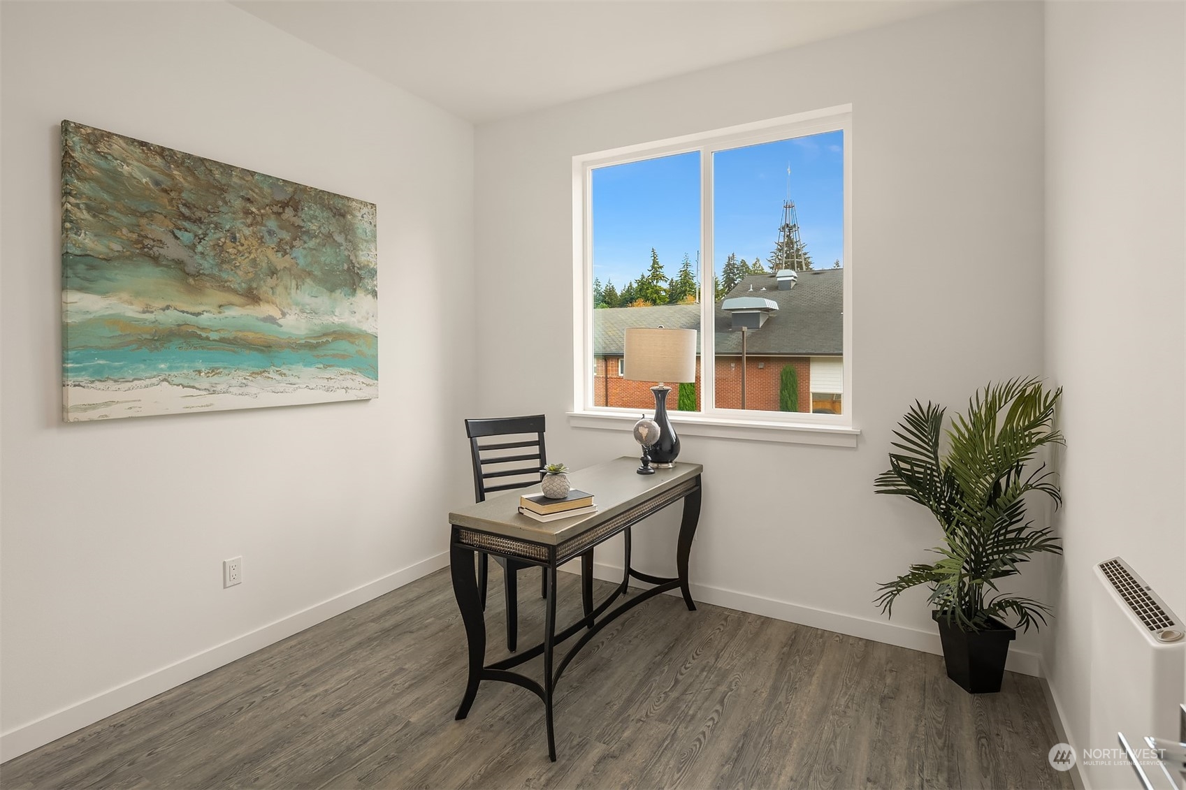115 Southwest 181st Place, Unit C11 Normandy Park, WA 98166 - Photo 5 of 26 a room with furniture and a potted plant