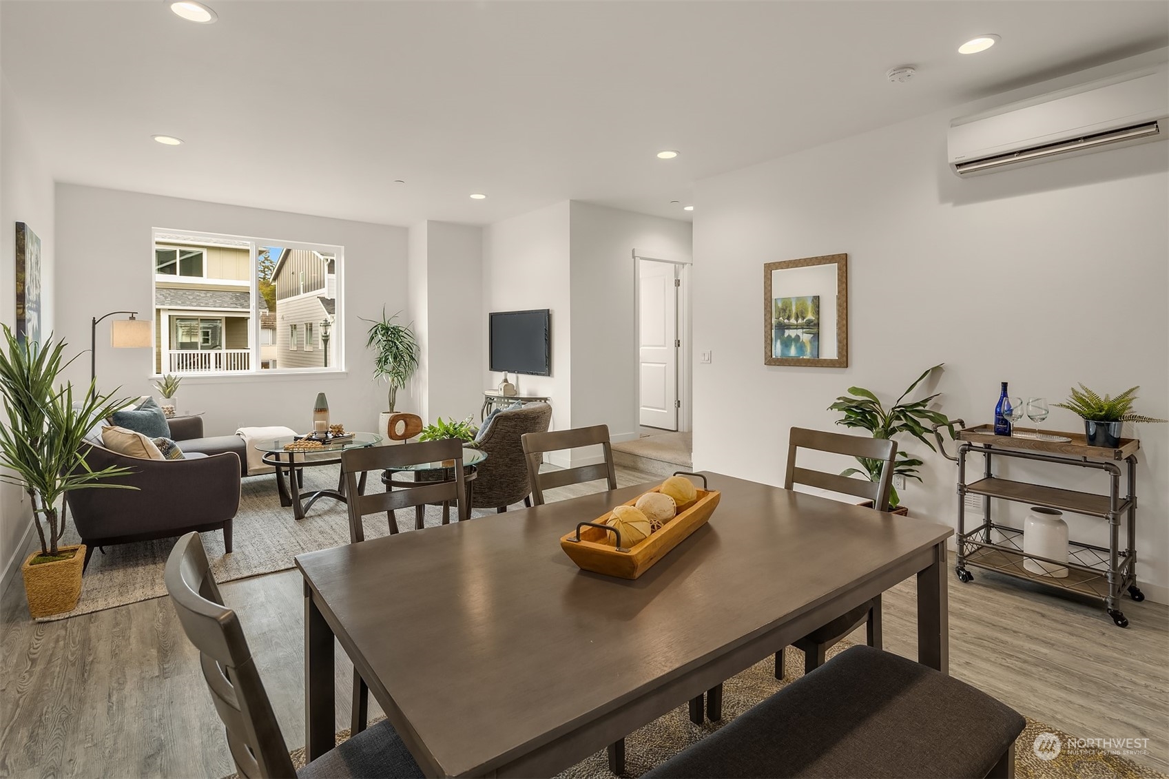 115 Southwest 181st Place, Unit C11 Normandy Park, WA 98166 - Photo 6 of 26 a view of a dining room with furniture and wooden floor