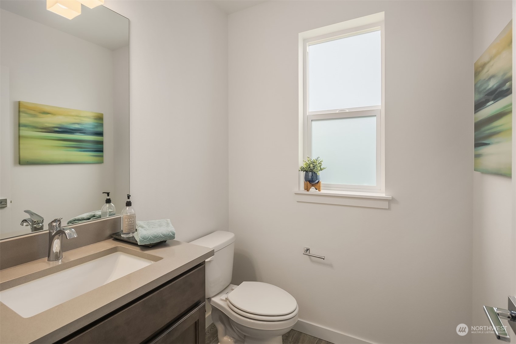 115 Southwest 181st Place, Unit C11 Normandy Park, WA 98166 - Photo 10 of 26 a bathroom with a granite countertop sink a toilet and a window