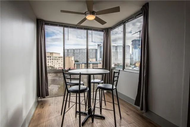 a view of a dining room with furniture window and outside view