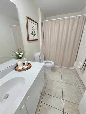 a view of a sink and a table in a room