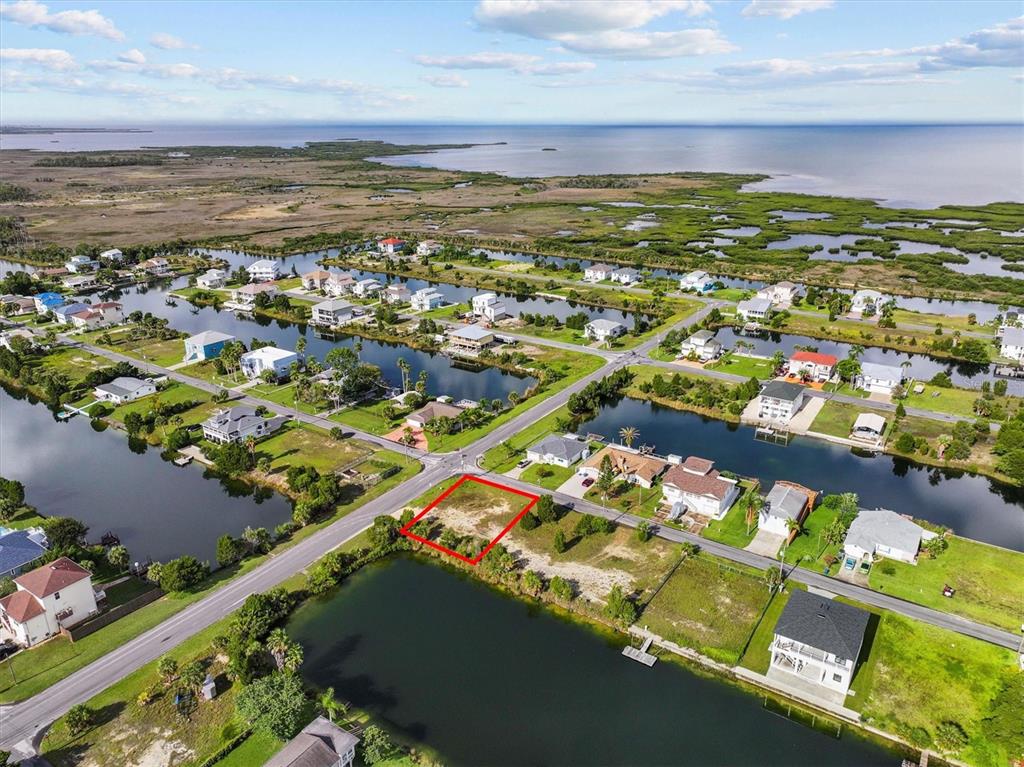3366 Crape Myrtle Drive Hernando Beach, FL 34607 - Photo 2 of 10 a view of a city with an ocean