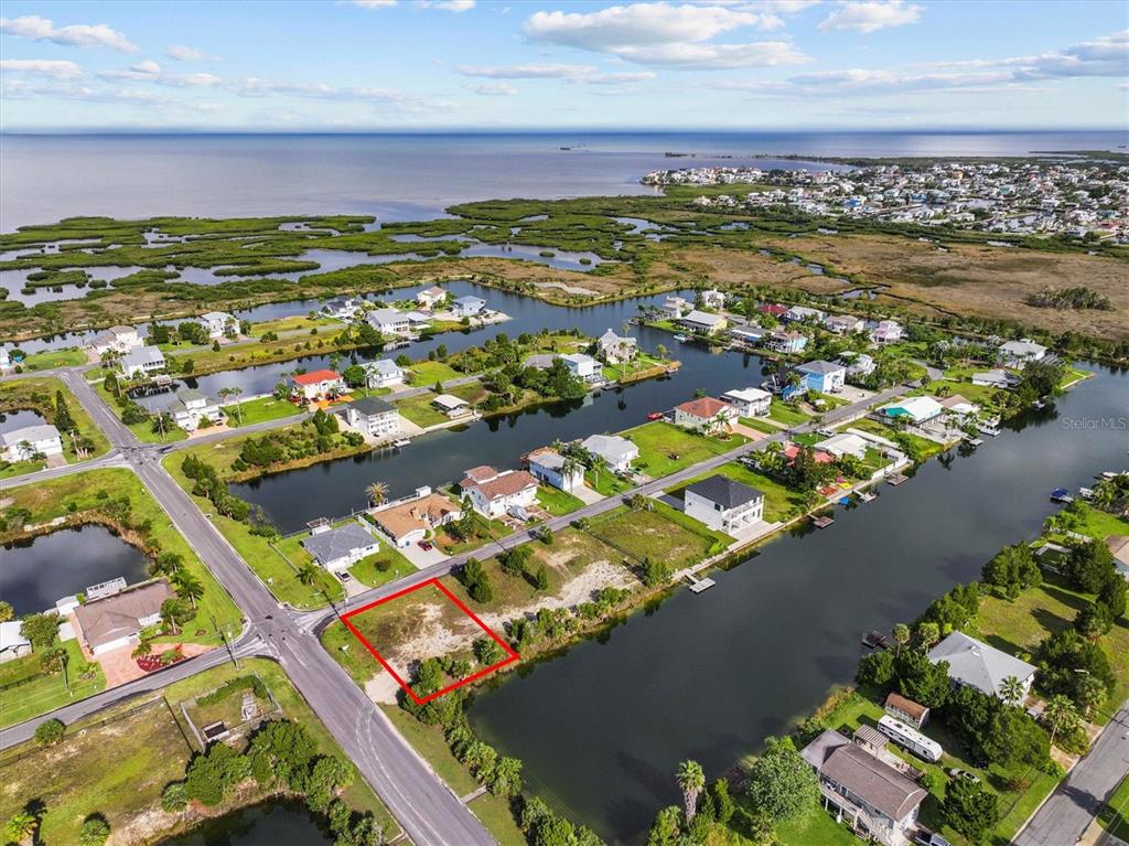 3366 Crape Myrtle Drive Hernando Beach, FL 34607 - Photo 3 of 10 an aerial view of residential houses with outdoor space