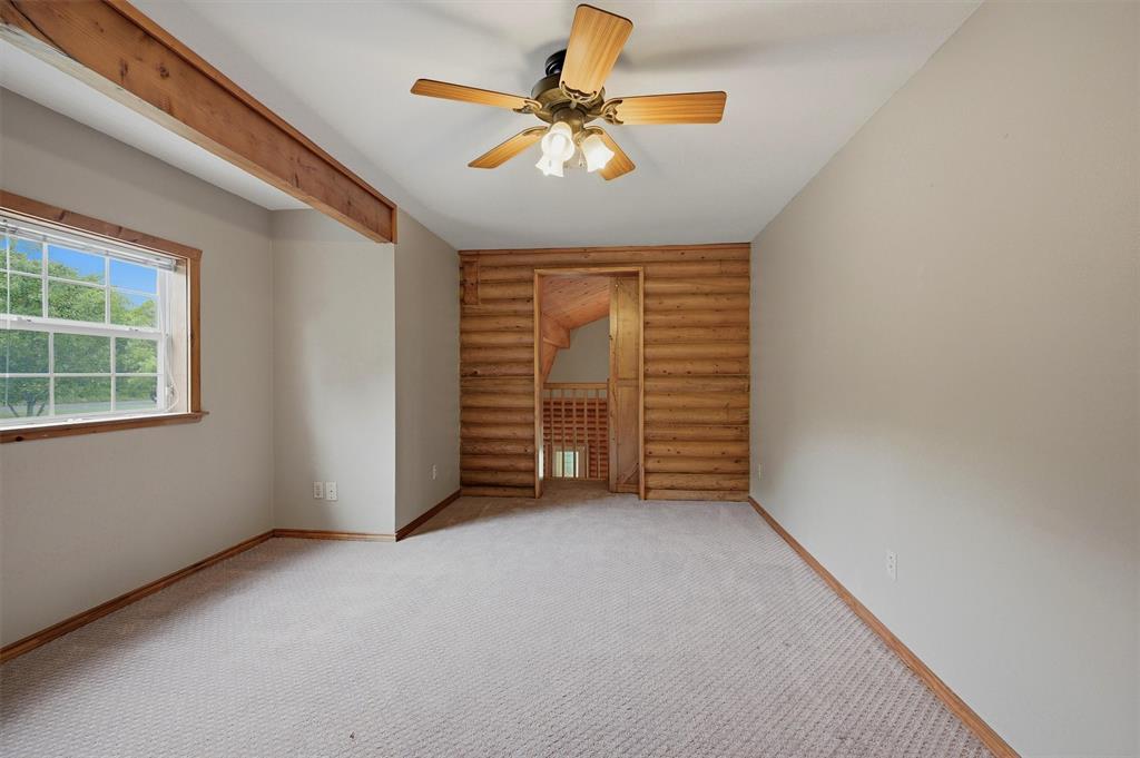 570 Ayres Road Bells, TX 75414 - Photo 25 of 40 an empty room with windows and fan