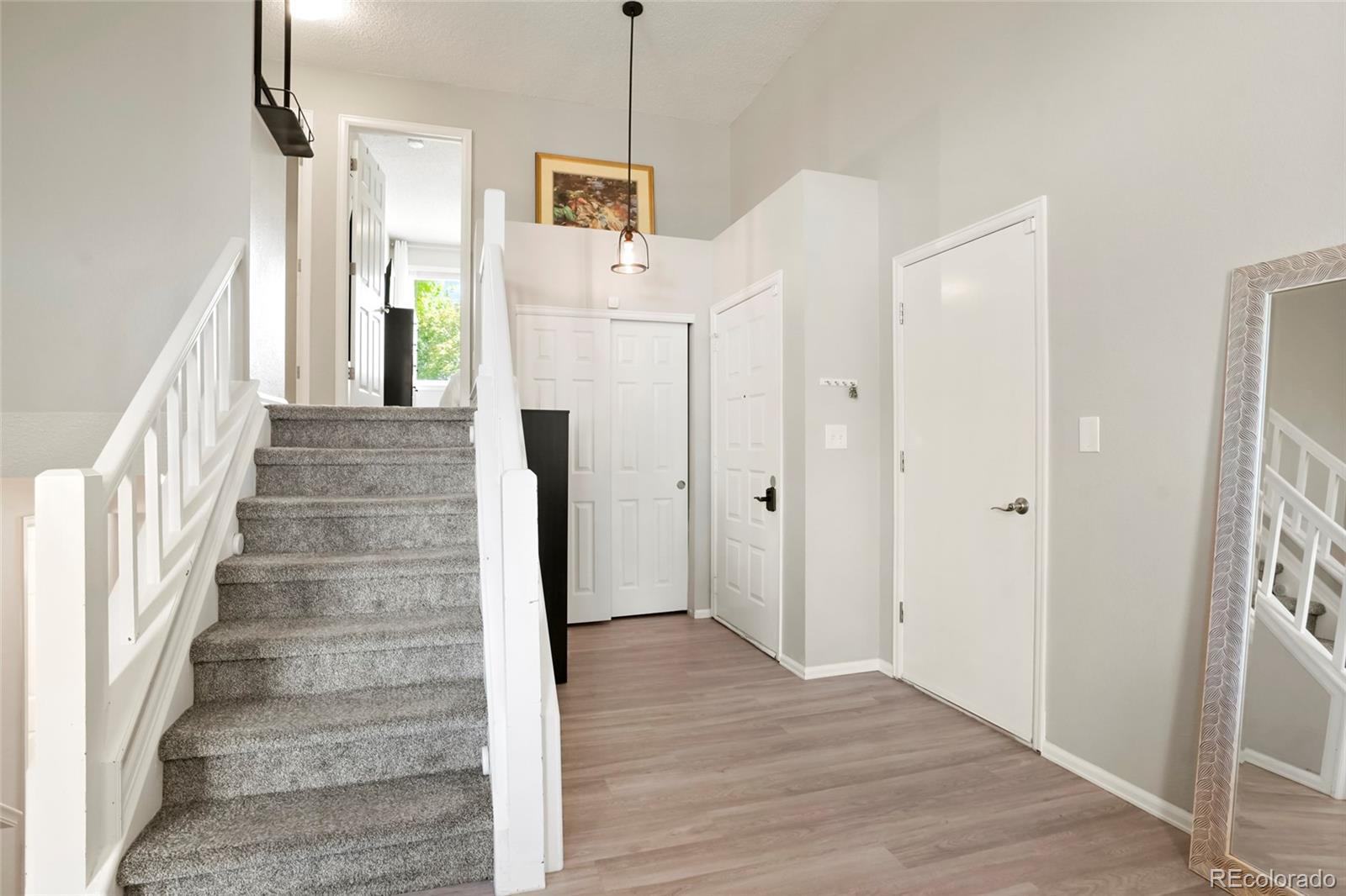 9191 Hickory Circle Highlands Ranch, CO 80126 - Photo 12 of 27 a view of an entryway with wooden floor