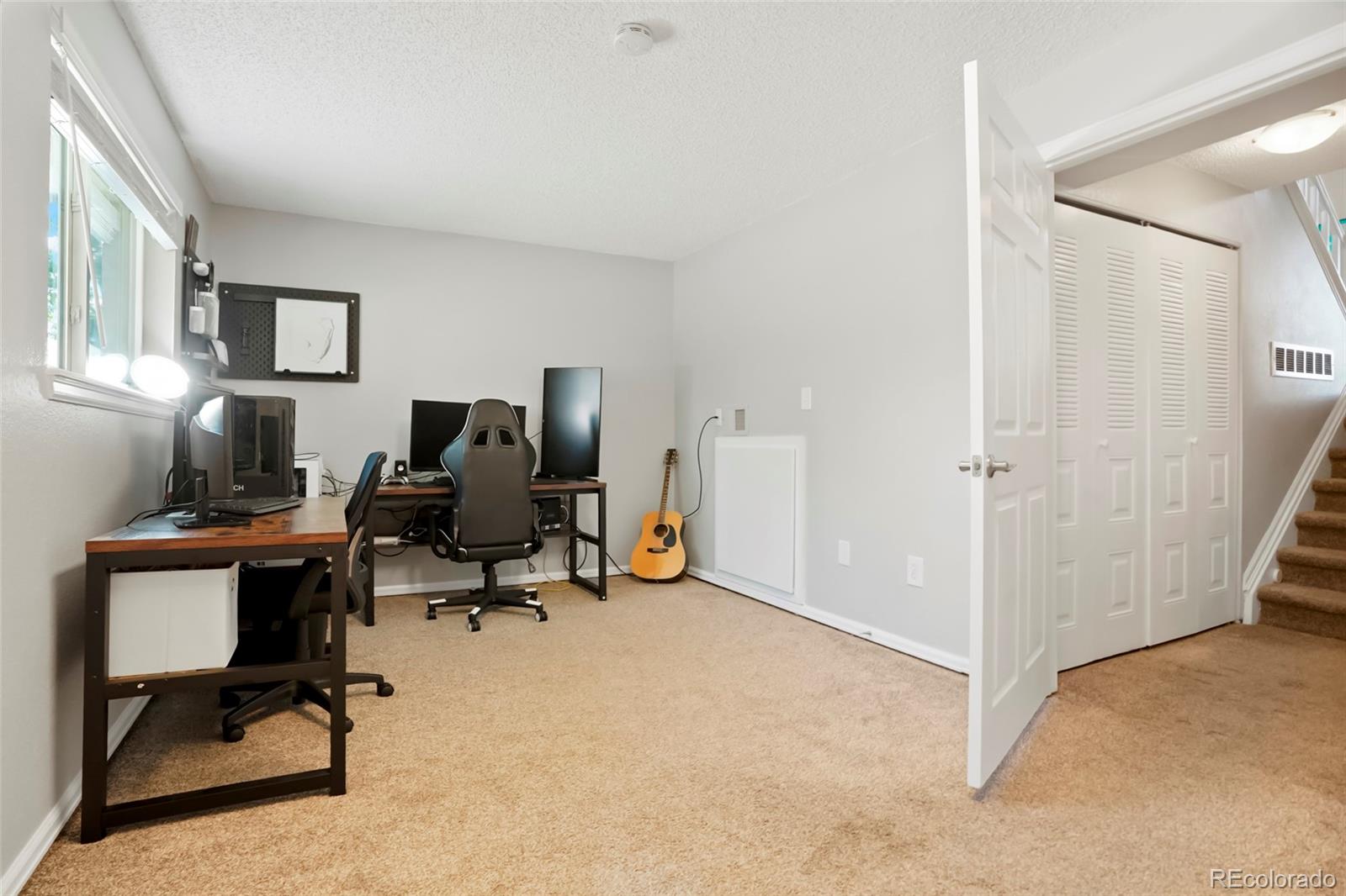 9191 Hickory Circle Highlands Ranch, CO 80126 - Photo 19 of 27 a view of a workspace with furniture and a window